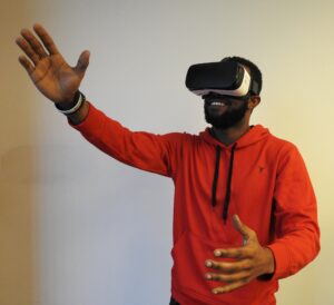 <img sra="virtualreality.jpeg" alt="man wearing VR glasses and smiling">